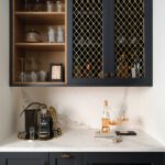 Coffee bar with black cabinetry and mesh door fronts
