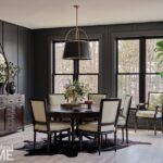 Dining room with black paneled walls