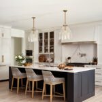 Kitchen with white cabinets and a black kitchen island
