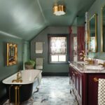 Vintage style bathroom with red tile and vanity