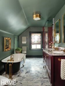 Vintage style bathroom with red tile and vanity
