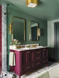 Vintage style bathroom with dark red vanity and green walls