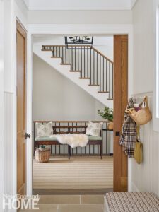 Entryway with a rustic wooden bench
