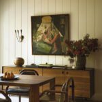 Custom dining table with vintage art work