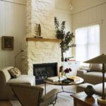 Neutral living room with large painted stone fireplace