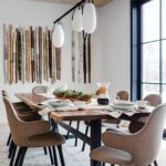 Neutral contemporary dining room with an art installation