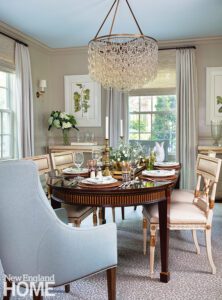 Formal dining room with a traditional table and contemporary chandelier