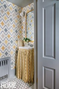 Powder room with geometric wallpaper