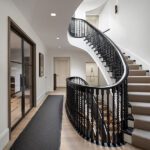 Dramatic curving ebony staircase