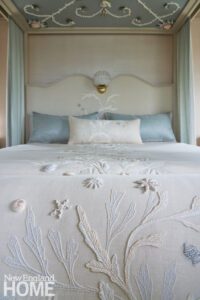 Bed covering with shell embroidery