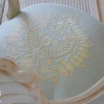 Chair upholstered in an elegant embroidered fabric
