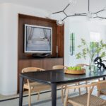 Dining room with dark wood dining table and light wooden chairs