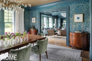 Dining room with wallpaper and blue trim