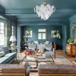 Blue color-drenched living room with a mix of traditional and contemporary furniture