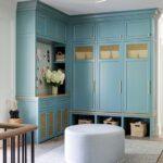 Mudroom with bright blue cabinetry