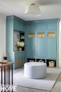 Mudroom with bright blue cabinetry