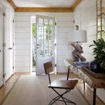 Entryway with shiplap walls and a desk and chair
