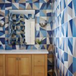 Powder room with graphic blue and white tiles