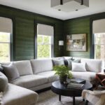 Den with dark walls and a large sectional