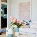 White couch with a contemporary art piece above