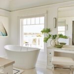 Coastal bathroom with a freestanding white bath tub