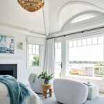Bright, white and airy primary bedroom in a coastal home