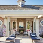 Pool house with a pergola and stone fireplace