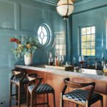Bar area with a wood bar and glossy blue walls