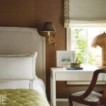 Primary bedroom with brown grasscloth walls