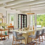 Dining area with a white lacquered table and upholstered chairs