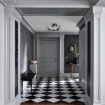 Formal foyer with gray walls and black and white flooring