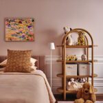 Girls room with rose colored walls.