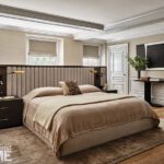 Primary bedroom with a tufted head board