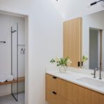 Contemporary bathroom with a floating light wood vanity