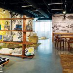 Contemporary showroom with concrete floors and wooden accents