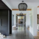 Contemporary entry with a large black woven light fixture