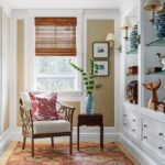 Second floor stair landing with grasscloth and a built-in bookcase