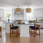 White kitchen with a T-shaped island