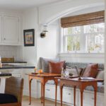 Dining banquette with two small antique tables
