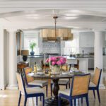 Dining area with a round table and rattan chairs