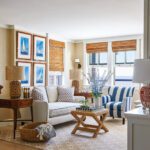 Second floor seating area with grass cloth and boating prints
