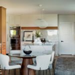 Kitchen seating area with a round table and upholstered chairs
