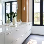 Primary bathroom with large contemporary white vanity
