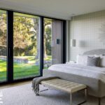 Neutral primary suite with a large sliding door