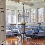 Large L-shaped kitchen banquette in a sunny breakfast nook