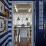 Entry hall to kitchen with blue and white striped horizontal wallpaper