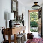 Entryway with an eclectic mix of furnishings and accessories