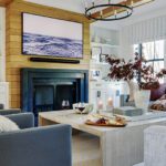Family room with a large fireplace and oak coffered ceiling.