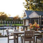 Outdoor entertaining space overlooking a pool.