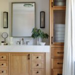 Primary bathroom with oak cabinetry